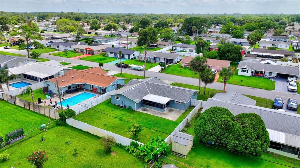 1309 Suwanee Road Daytona Beach, FL 32114 - Photo 30 of 33 an aerial view of multiple houses with yard