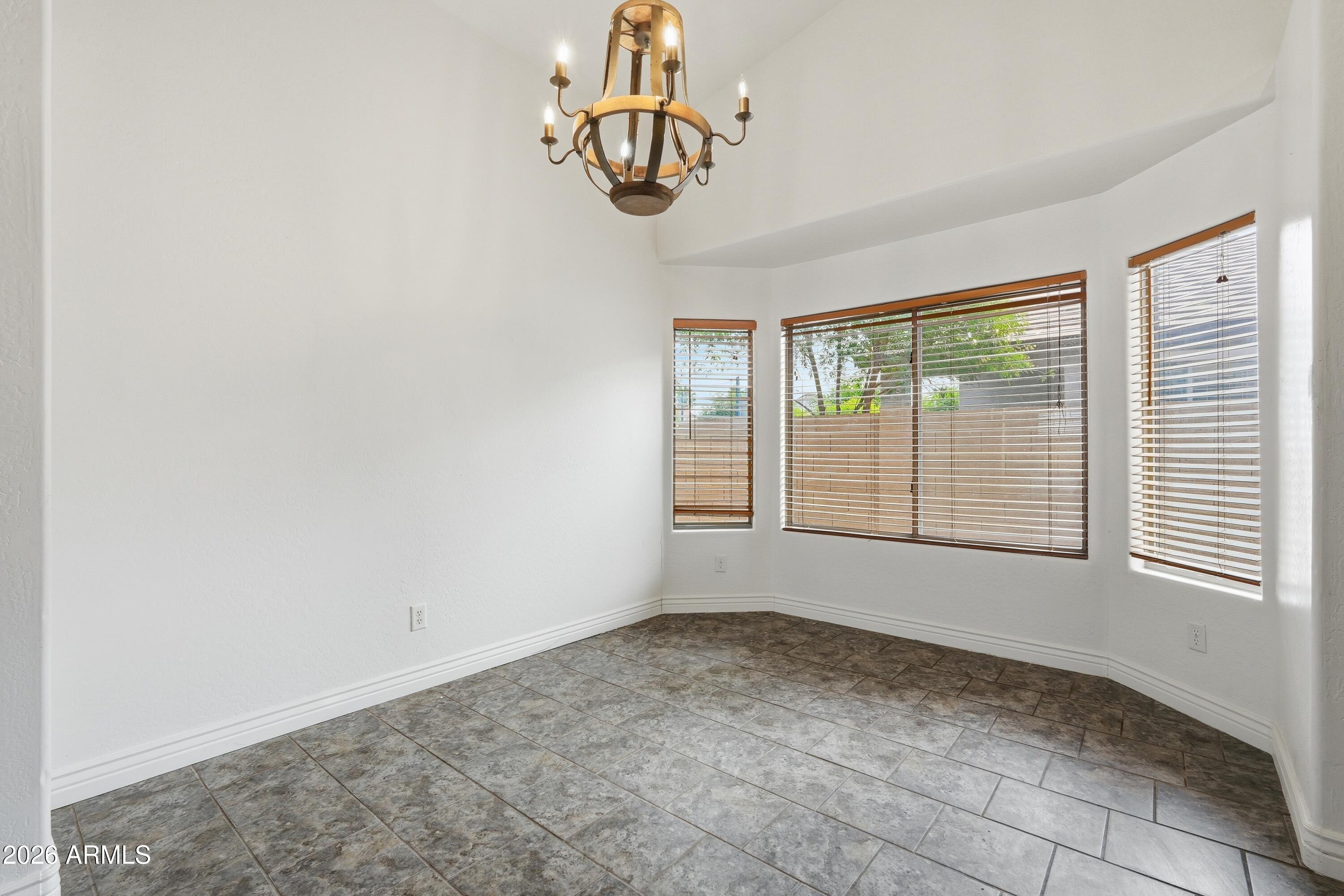 3242 East Bonanza Road Gilbert, AZ 85297 - Photo 12 of 36 a view of an empty room with a window