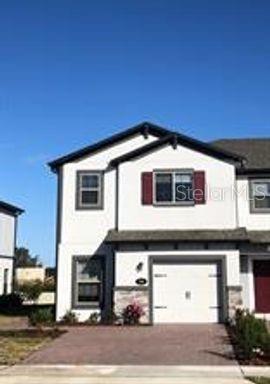 250 Evertree Loop Sanford, FL 32771 - Photo 1 of 19 a front view of a house with car parked