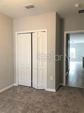250 Evertree Loop Sanford, FL 32771 - Photo 11 of 19 an empty room with windows