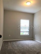250 Evertree Loop Sanford, FL 32771 - Photo 12 of 19 an empty room with a window