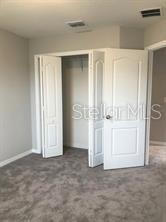 250 Evertree Loop Sanford, FL 32771 - Photo 14 of 19 an empty room with windows