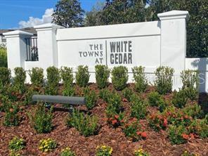 250 Evertree Loop Sanford, FL 32771 - Photo 19 of 19 a view of a wooden house with plants and trees