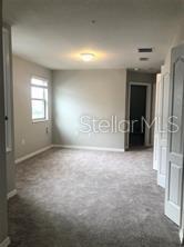 250 Evertree Loop Sanford, FL 32771 - Photo 6 of 19 an empty room with windows and closet