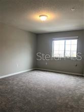 250 Evertree Loop Sanford, FL 32771 - Photo 7 of 19 an empty room with a window