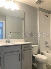 250 Evertree Loop Sanford, FL 32771 - Photo 10 of 19 a bathroom with a sink toilet and shower