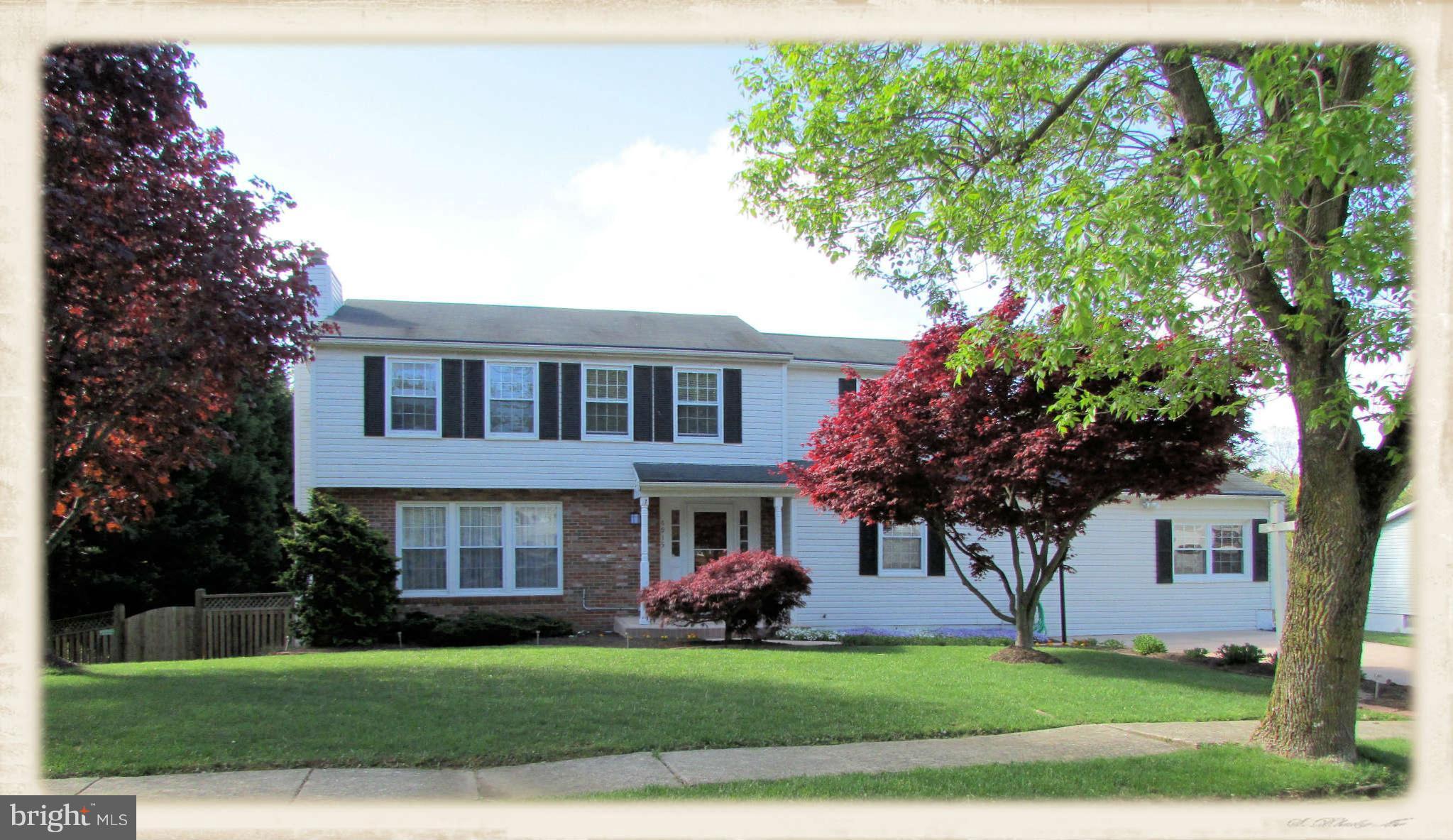 6915 Pinecrest Road Baltimore, MD 21228 - Photo 1 of 30 a front view of a house with a garden