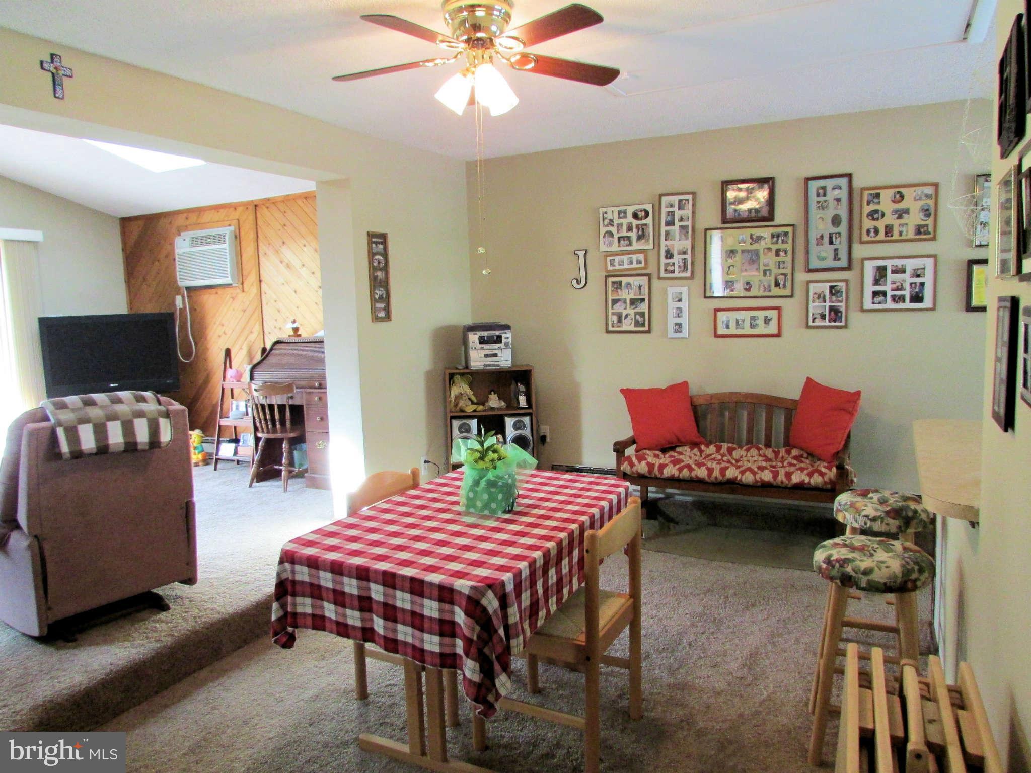6915 Pinecrest Road Baltimore, MD 21228 - Photo 14 of 30 a living room with furniture and wooden floor