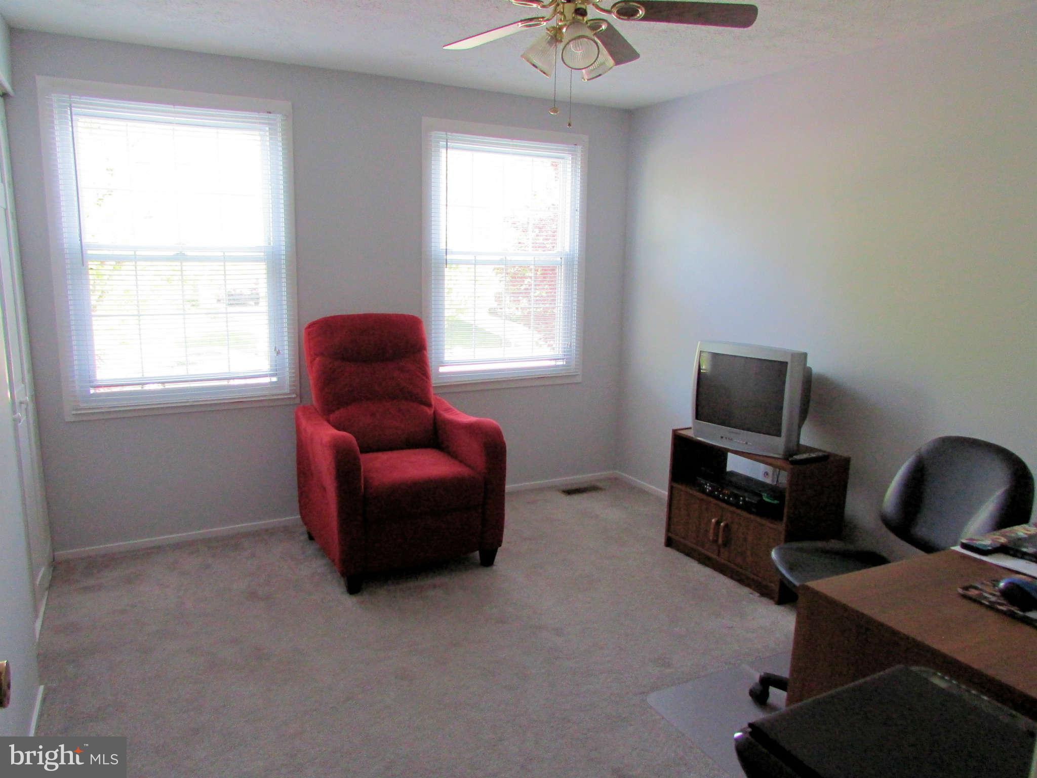 6915 Pinecrest Road Baltimore, MD 21228 - Photo 19 of 30 a living room with furniture and a window
