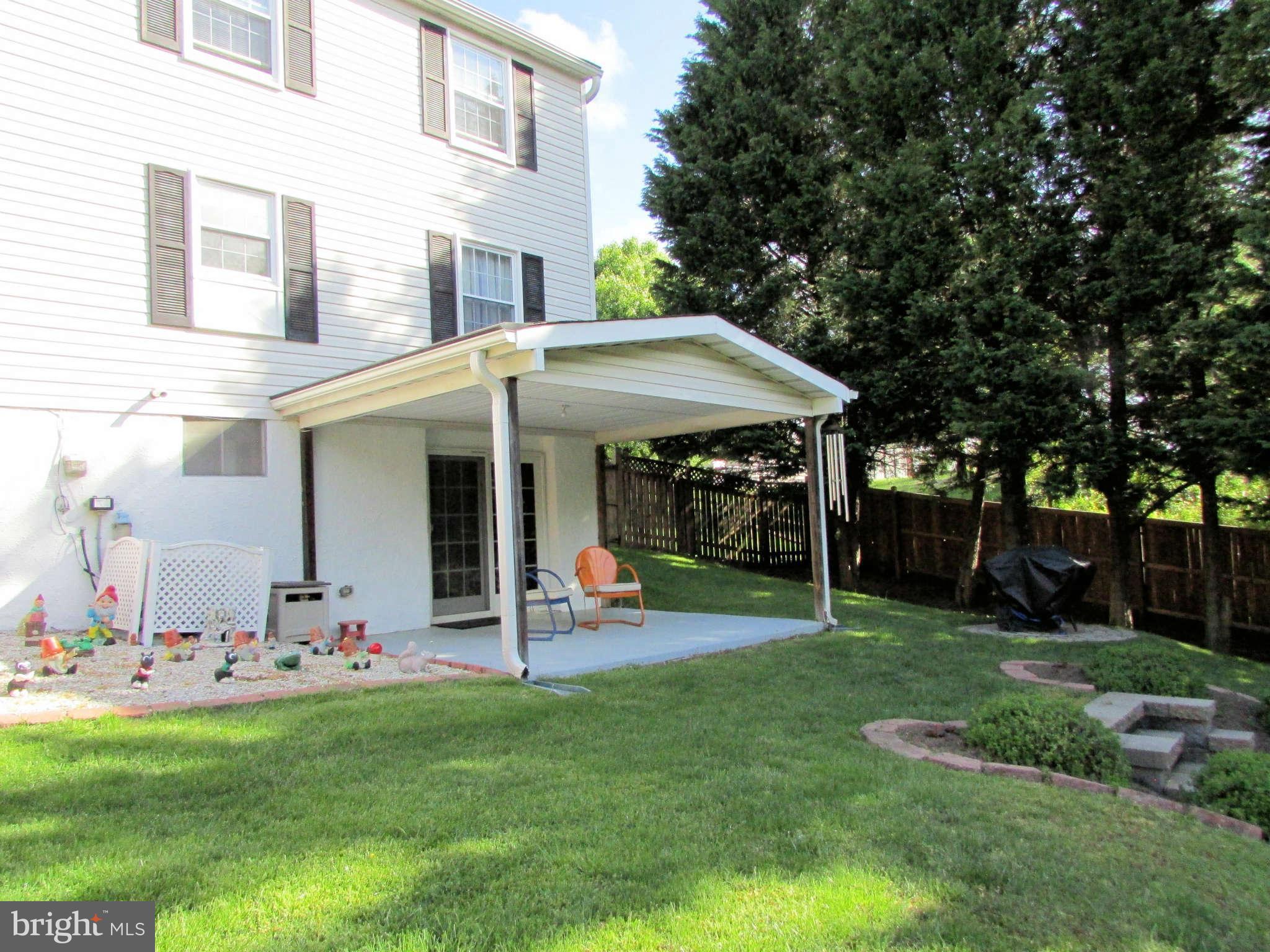6915 Pinecrest Road Baltimore, MD 21228 - Photo 28 of 30 front view of a house with a yard