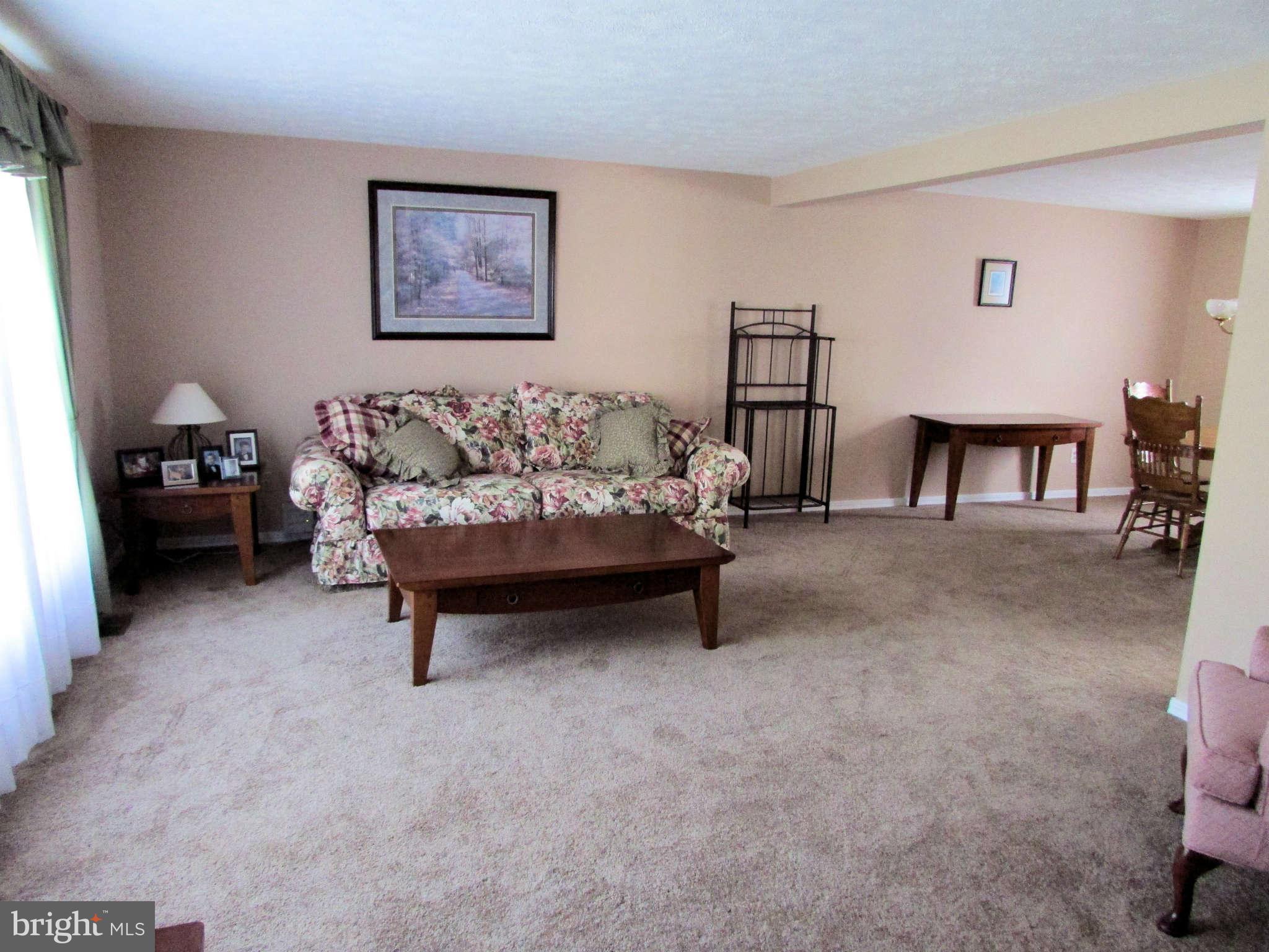 6915 Pinecrest Road Baltimore, MD 21228 - Photo 5 of 30 a living room with furniture and a table