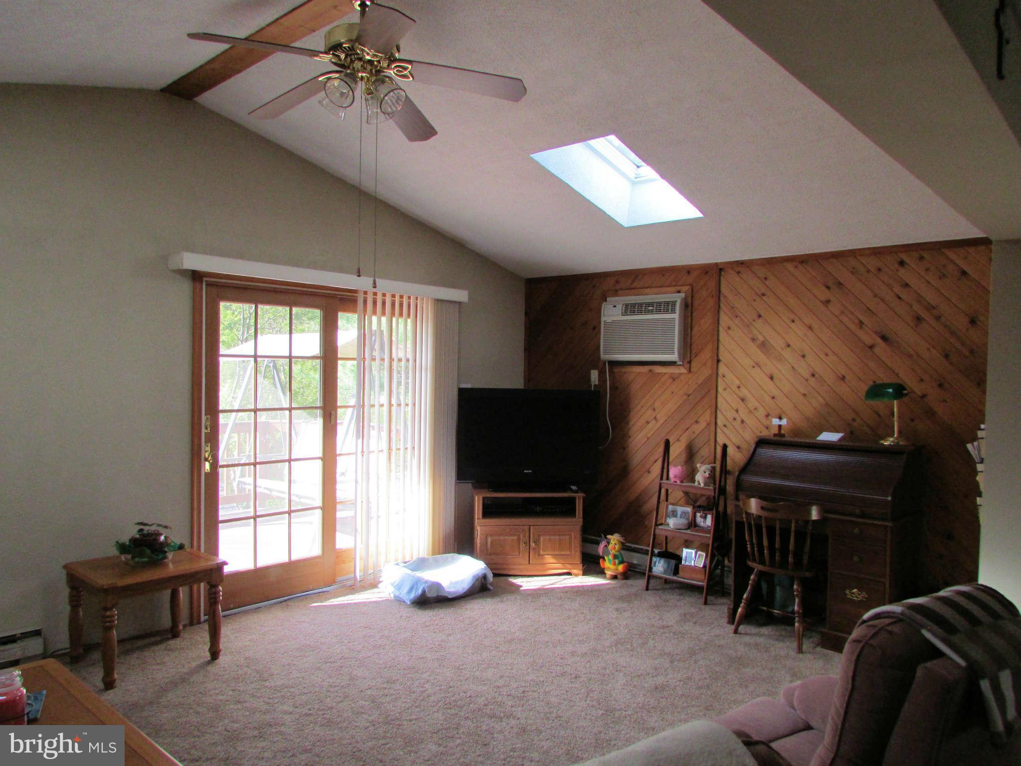 6915 Pinecrest Road Baltimore, MD 21228 - Photo 10 of 30 a living room with furniture and a flat screen tv