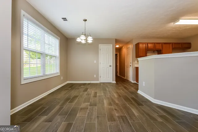 a view of livingroom with hardwood floor and window