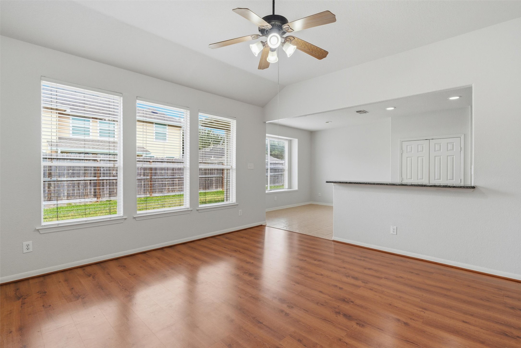 4607 Sebastopol Drive Pearland, TX 77584 - Photo 8 of 26 a view of an empty room with a window and wooden floor