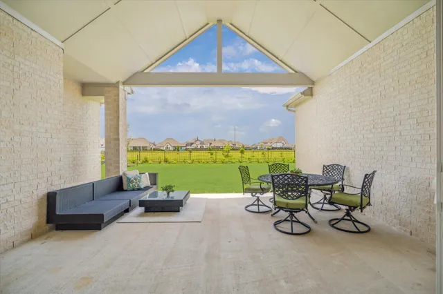 a view of a golf course with a lake view