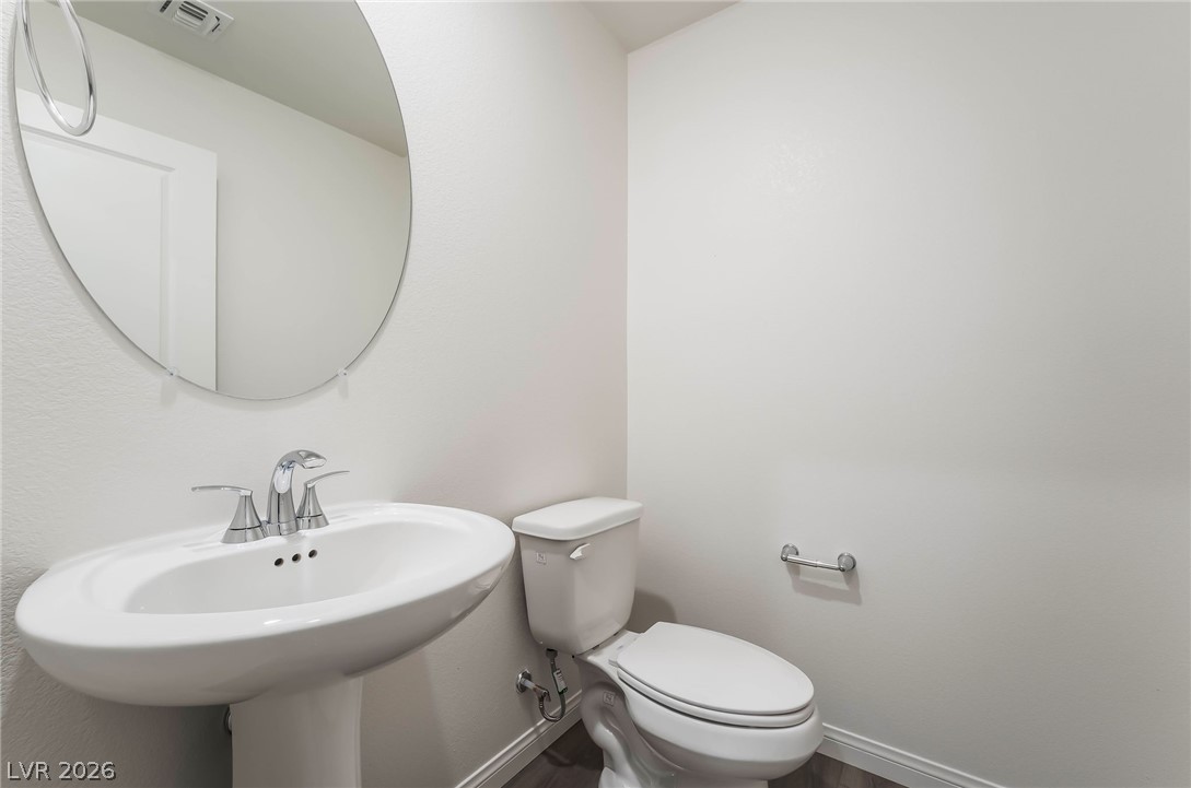3759 Via Allegro Henderson, NV 89044 - Photo 18 of 44 Half bath with wood finished floors