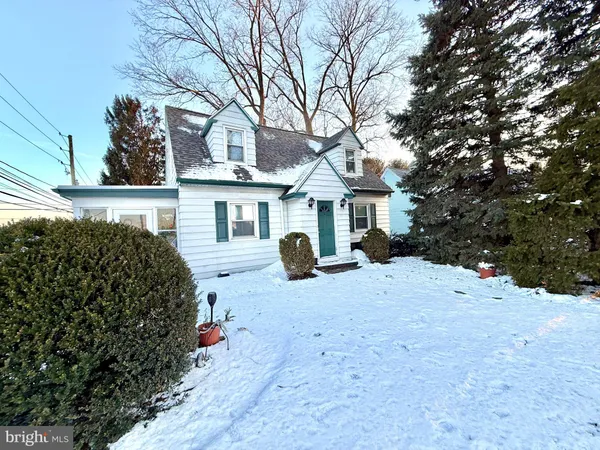 a view of a house with a snow in a yard