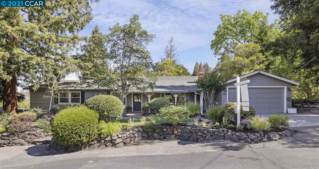 a view of a garden with a house
