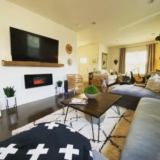 a living room with furniture and a flat screen tv