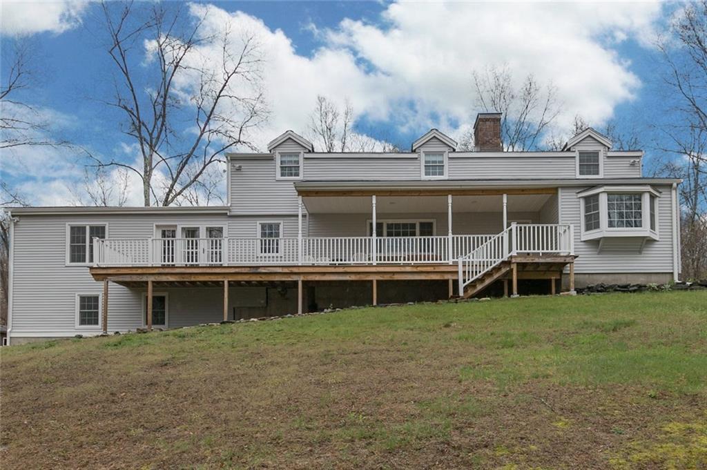 209 Bunker Hill Road Andover, CT 06232 - Photo 1 of 1 a view of a house with a garden and deck