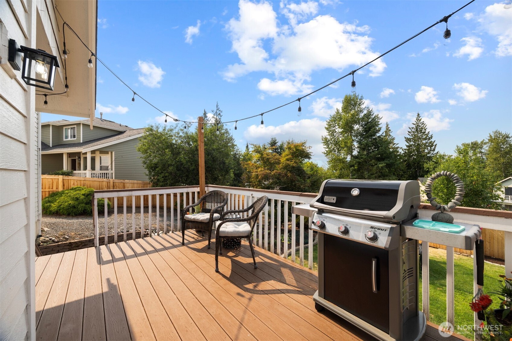 3941 Lakemont Road Bellingham, WA 98226 - Photo 11 of 40 a view of a patio with a table and chairs with wooden floor