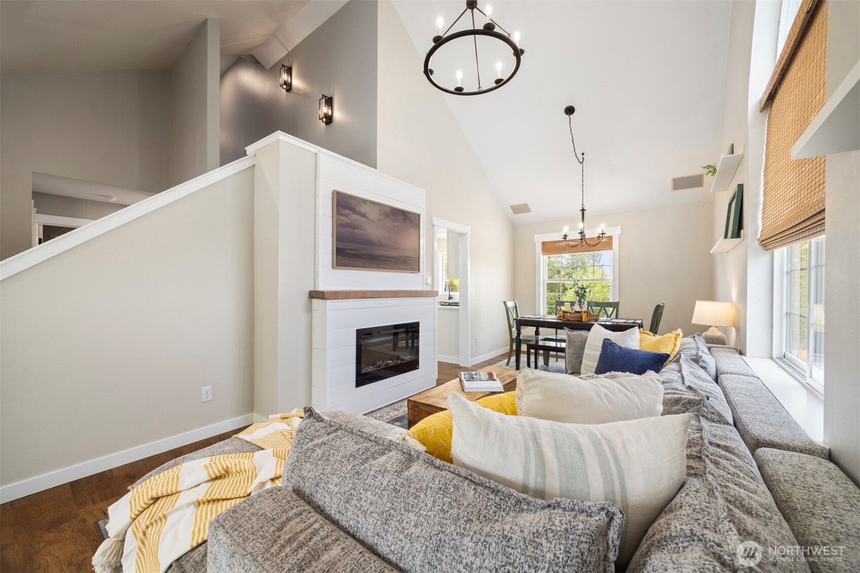 3941 Lakemont Road Bellingham, WA 98226 - Photo 17 of 40 a living room with furniture a fireplace and a floor to ceiling window