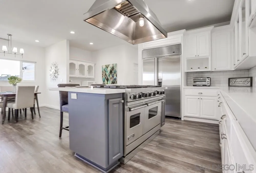 39431 American Road Fallbrook, CA 92028 - Photo 13 of 62 a kitchen with stainless steel appliances kitchen island granite countertop a stove a sink and a refrigerator