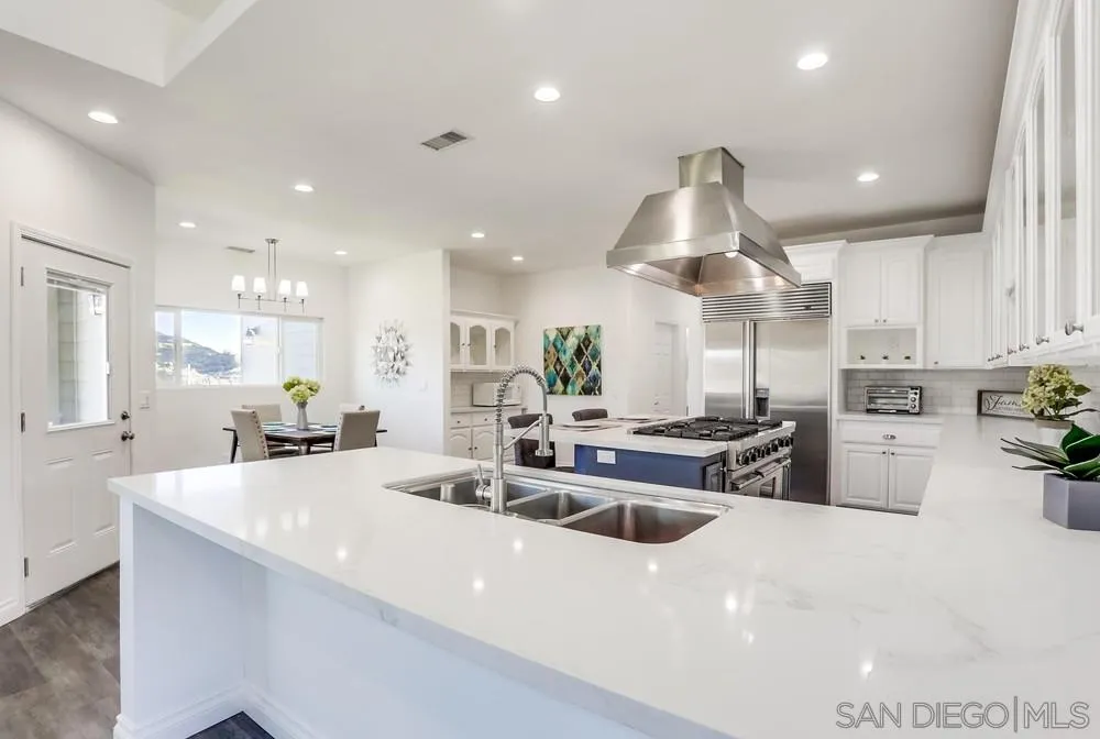 39431 American Road Fallbrook, CA 92028 - Photo 16 of 62 a kitchen with stainless steel appliances granite countertop a sink a stove and a refrigerator