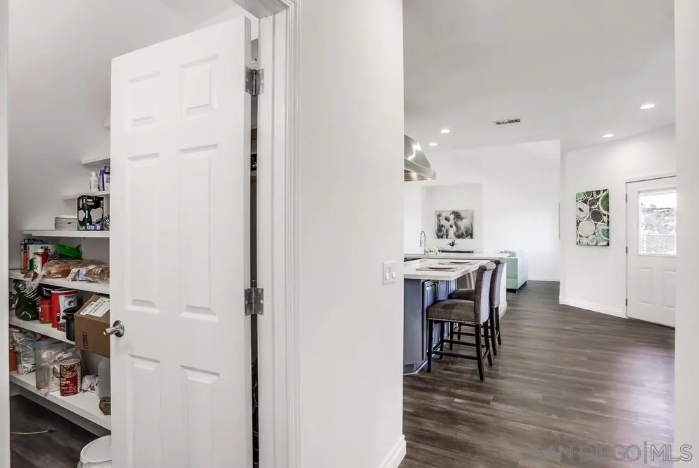39431 American Road Fallbrook, CA 92028 - Photo 17 of 62 a view of a dining room with furniture and wooden floor