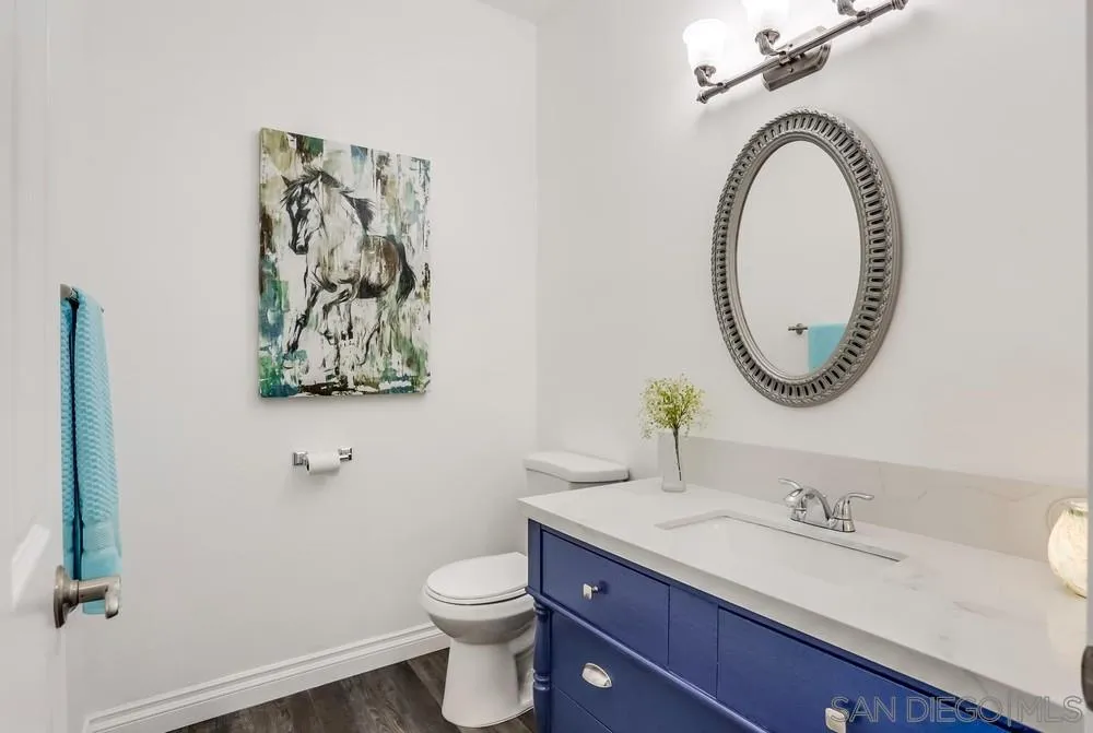 39431 American Road Fallbrook, CA 92028 - Photo 18 of 62 a bathroom with a toilet a sink and a mirror
