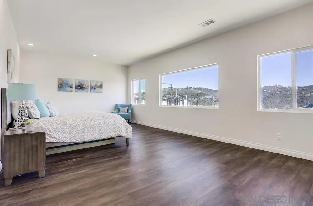 39431 American Road Fallbrook, CA 92028 - Photo 27 of 62 a bedroom with a large bed and a window