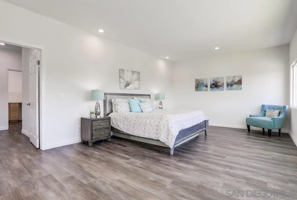 39431 American Road Fallbrook, CA 92028 - Photo 29 of 62 a spacious bedroom with a bed and a table