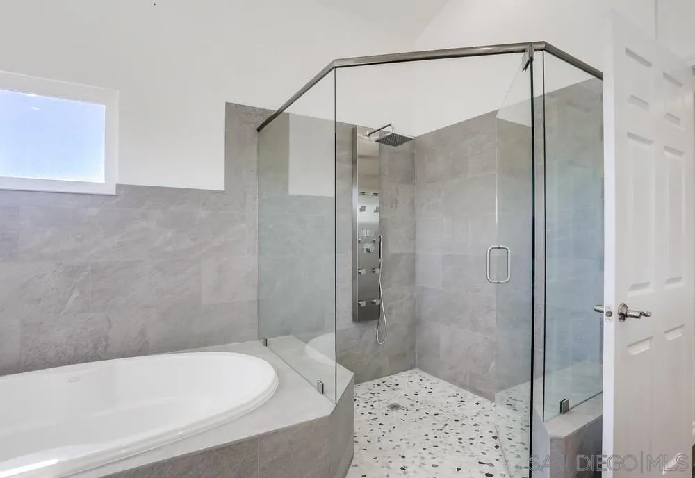 39431 American Road Fallbrook, CA 92028 - Photo 31 of 62 a bathroom with a bathtub and shower