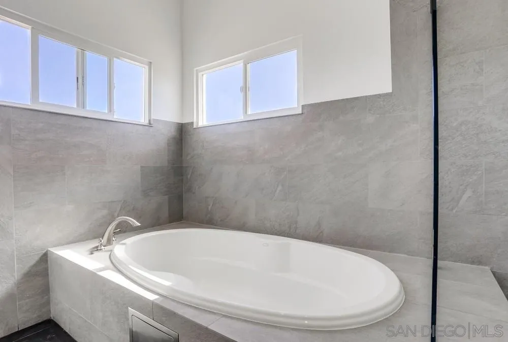 39431 American Road Fallbrook, CA 92028 - Photo 32 of 62 a white bath tub sitting in a bathroom