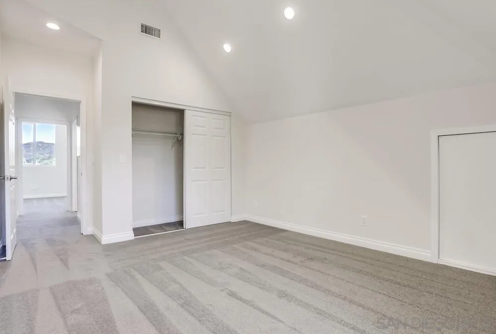 39431 American Road Fallbrook, CA 92028 - Photo 35 of 62 an empty room with wooden floor and windows