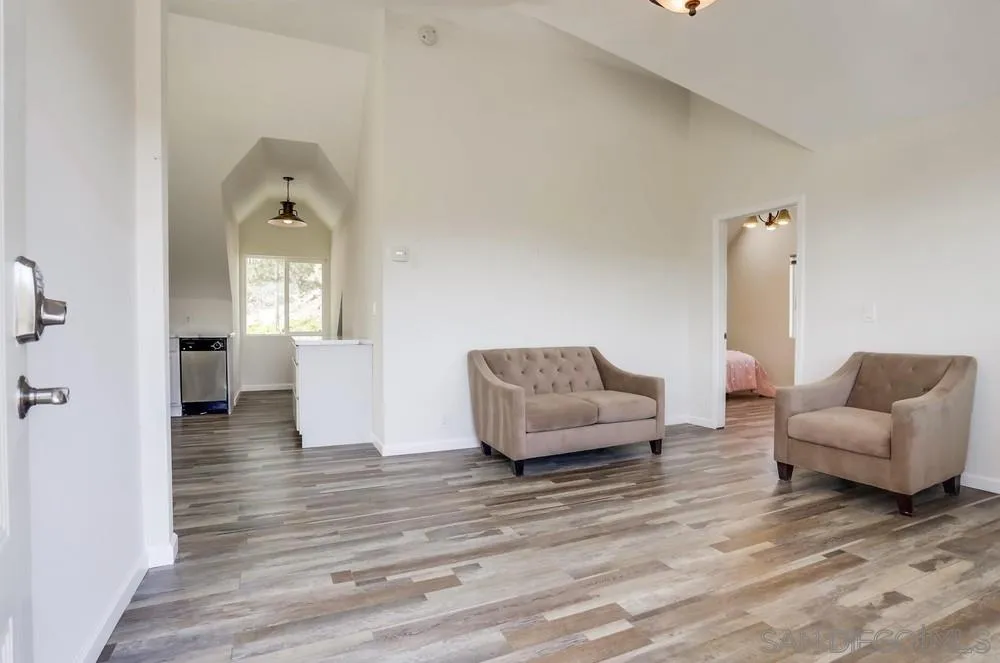 39431 American Road Fallbrook, CA 92028 - Photo 46 of 62 a living room with furniture and a wooden floor