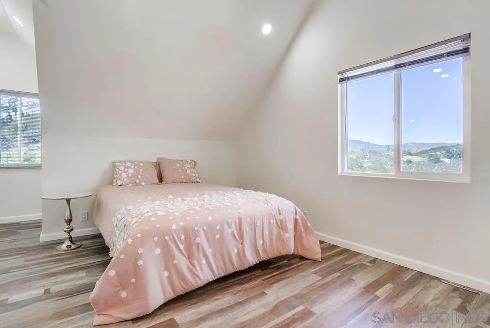 39431 American Road Fallbrook, CA 92028 - Photo 50 of 62 a bedroom with a bed and wooden floor