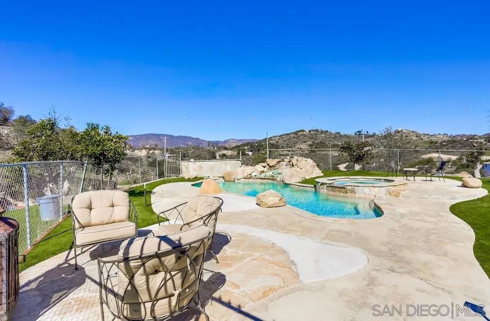 39431 American Road Fallbrook, CA 92028 - Photo 54 of 62 a view of a swimming pool and lounge chairs
