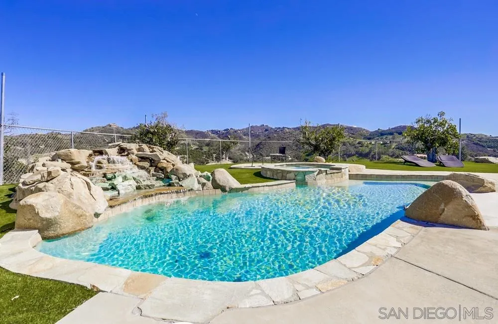 39431 American Road Fallbrook, CA 92028 - Photo 55 of 62 a view of a swimming pool with a yard and large tree