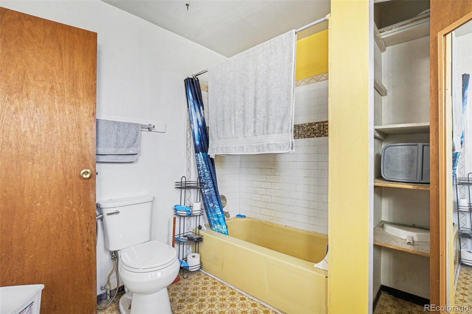 901 County Road 3 Wiggins, CO 80654 - Photo 16 of 28 a bathroom with a tub toilet and sink
