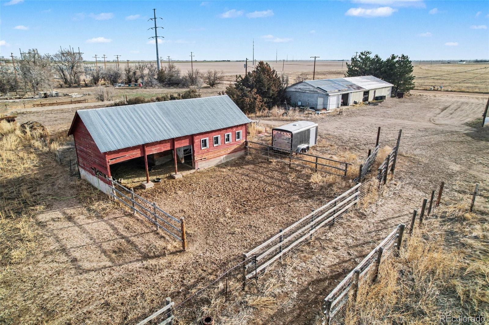 901 County Road 3 Wiggins, CO 80654 - Photo 23 of 28 a view of a terrace with a yard