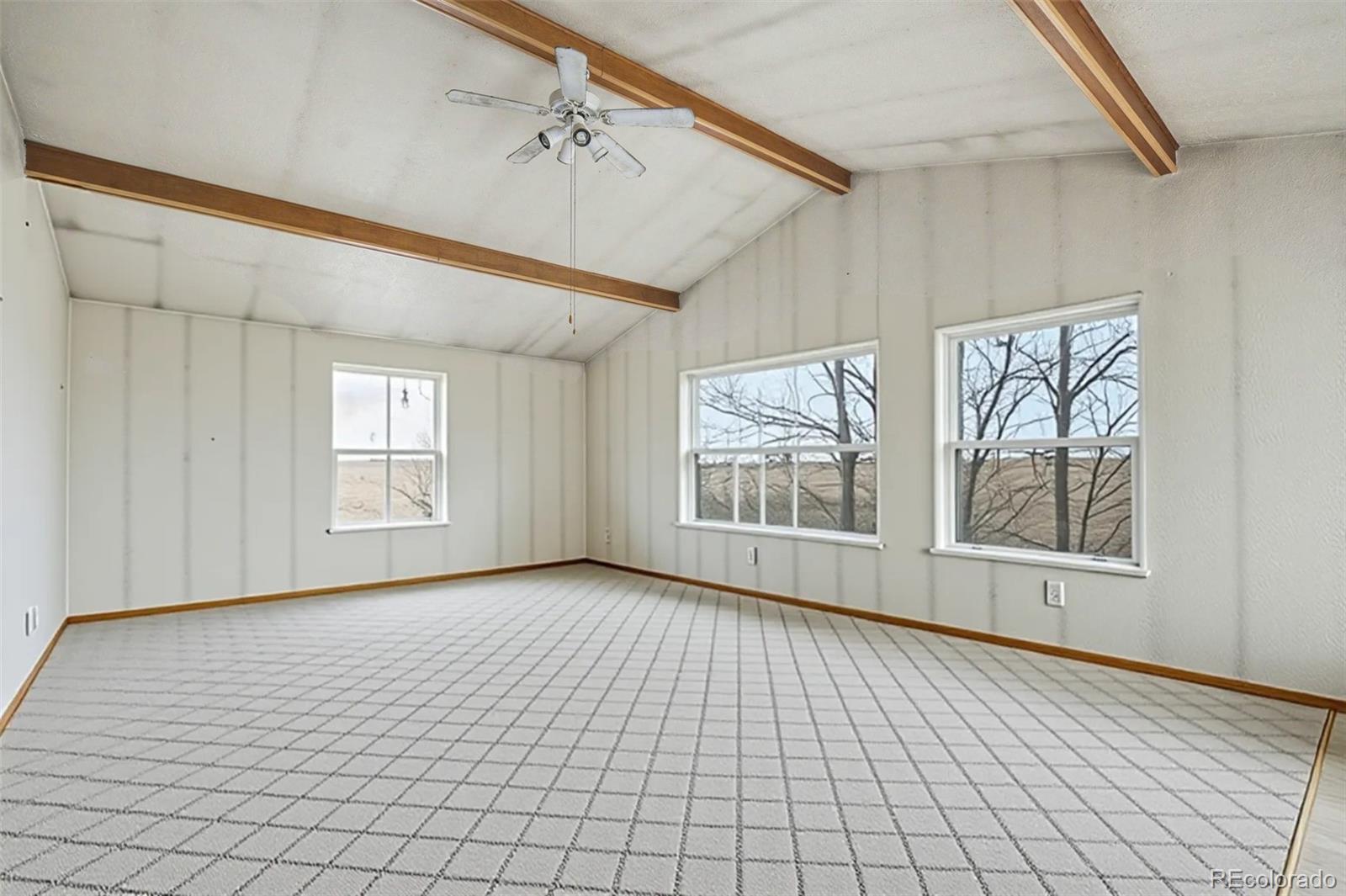 901 County Road 3 Wiggins, CO 80654 - Photo 6 of 28 a view of an empty room with a window