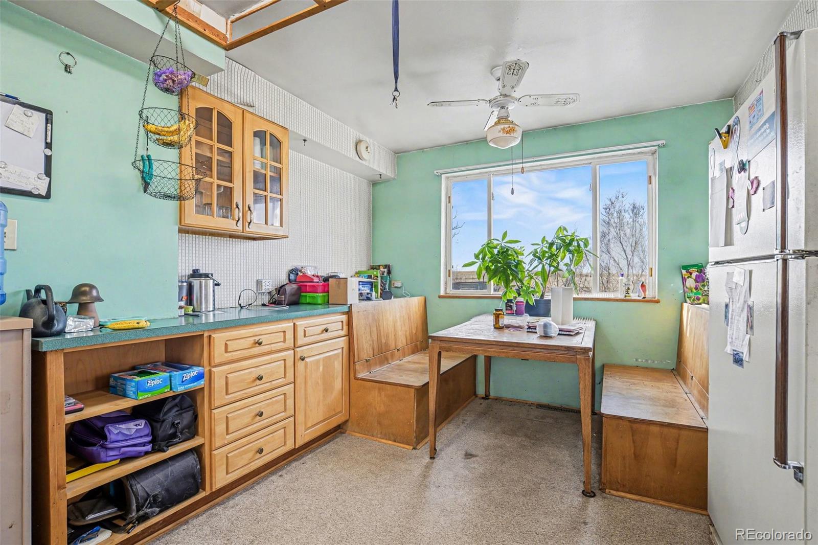 901 County Road 3 Wiggins, CO 80654 - Photo 10 of 28 a room with furniture a chandelier and a window