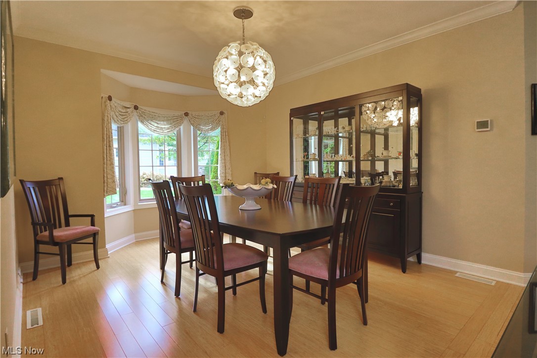8257 Morley Road Mentor, OH 44060 - Photo 15 of 35 Dining space featuring crown molding, and bamboo wood flooring