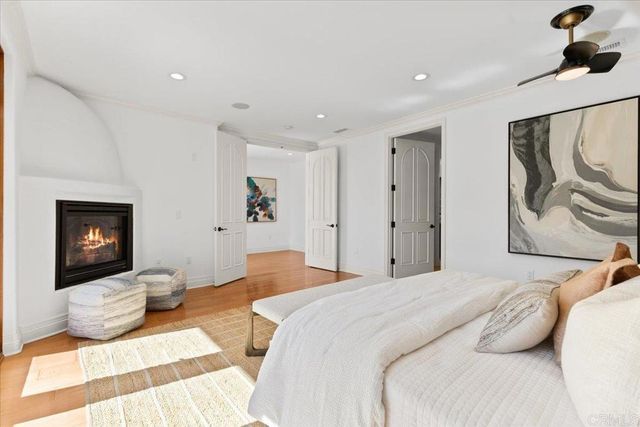 a bathroom with a granite countertop sink a mirror and a shower