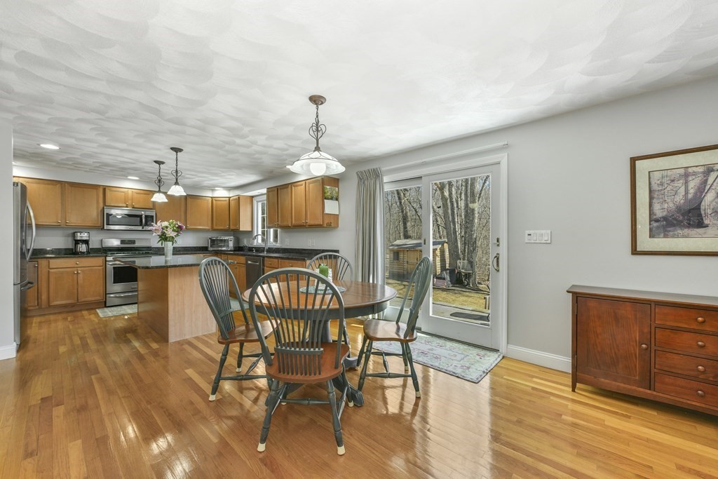 211 Pearl Street Reading, MA 01867 - Photo 12 of 34 a view of a dining room with furniture window and wooden floor