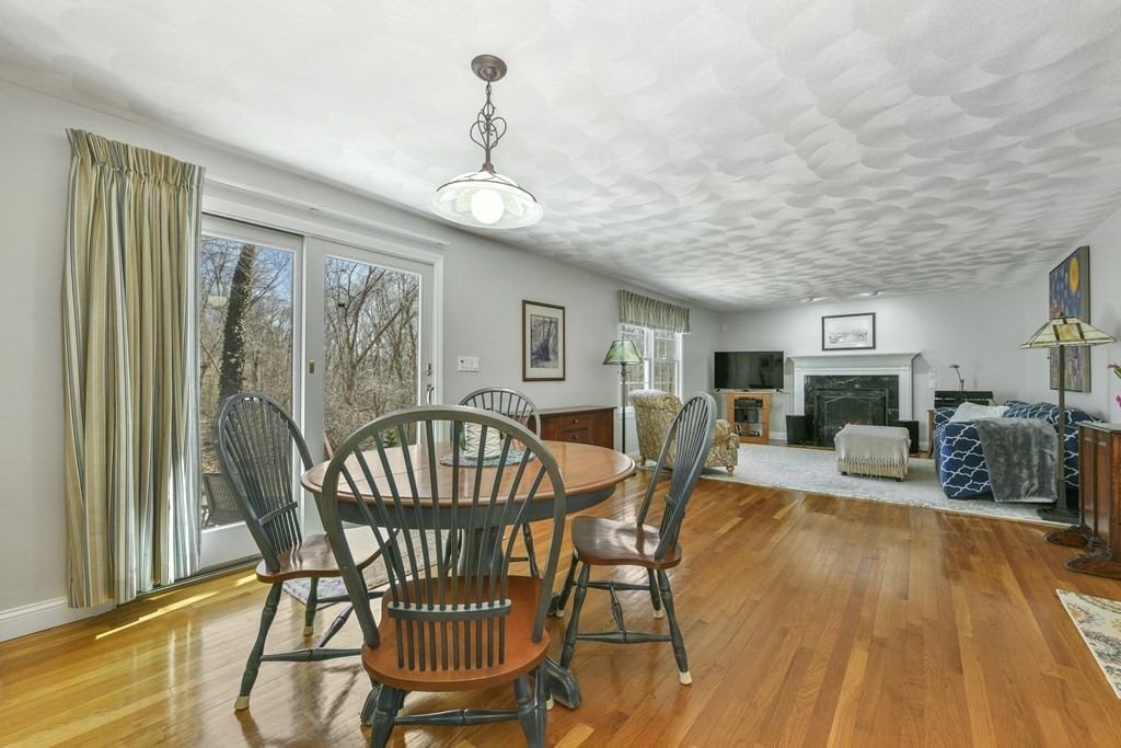 211 Pearl Street Reading, MA 01867 - Photo 13 of 34 a dining room with furniture a chandelier and wooden floor
