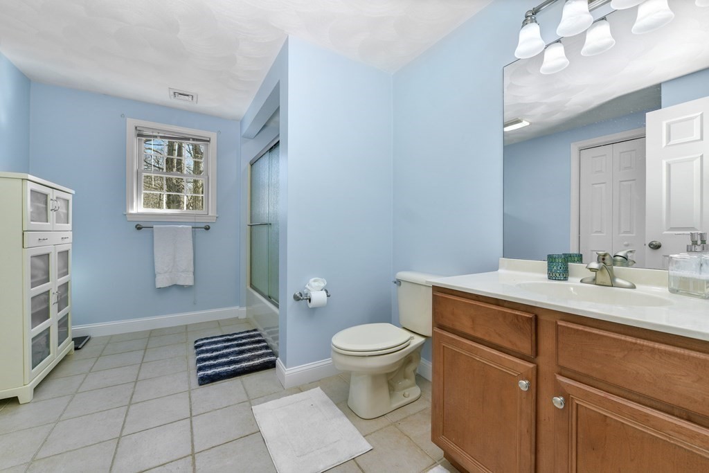 211 Pearl Street Reading, MA 01867 - Photo 22 of 34 a spacious bathroom with a sink toilet and shower
