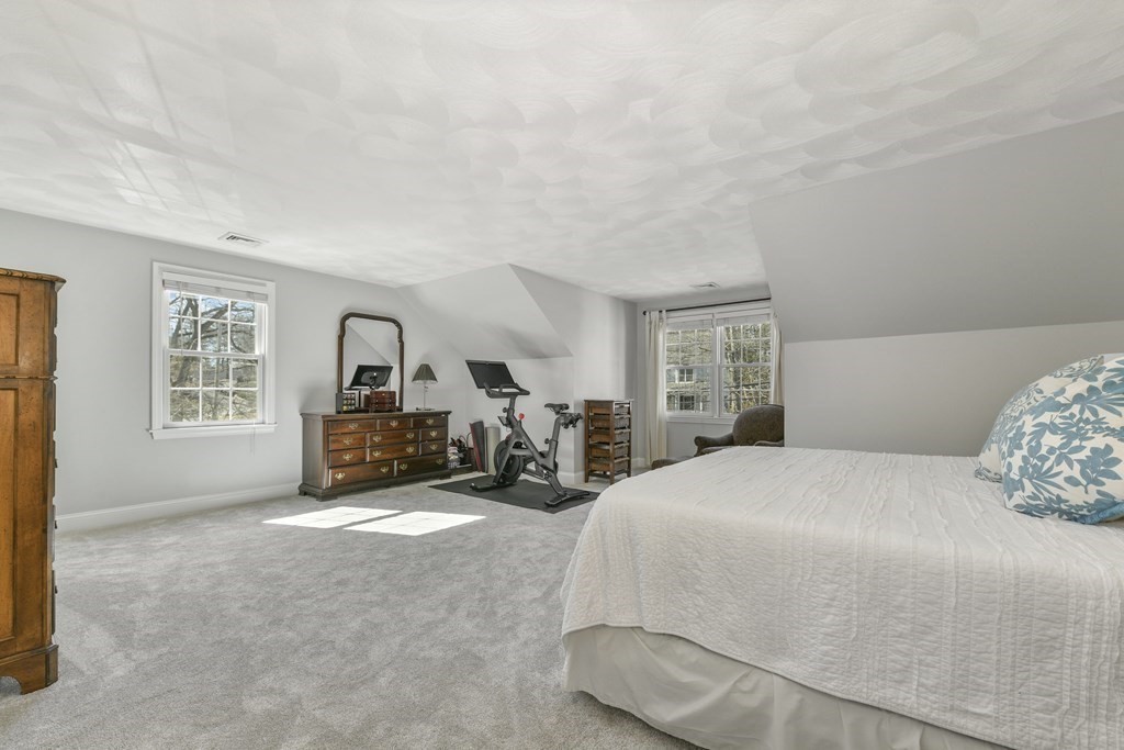 211 Pearl Street Reading, MA 01867 - Photo 23 of 34 a bed room with a bed and a tv