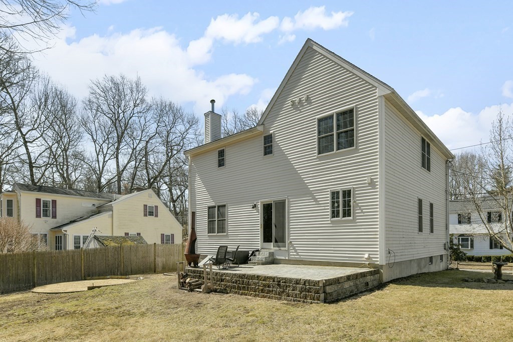 211 Pearl Street Reading, MA 01867 - Photo 31 of 34 a front view of a house with a yard